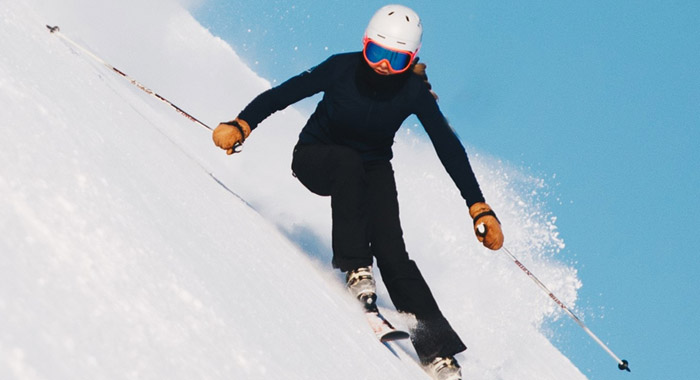 Skier on steep slope.