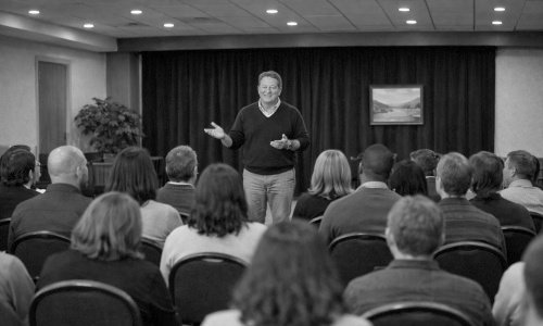 Paul presenting to a large group.